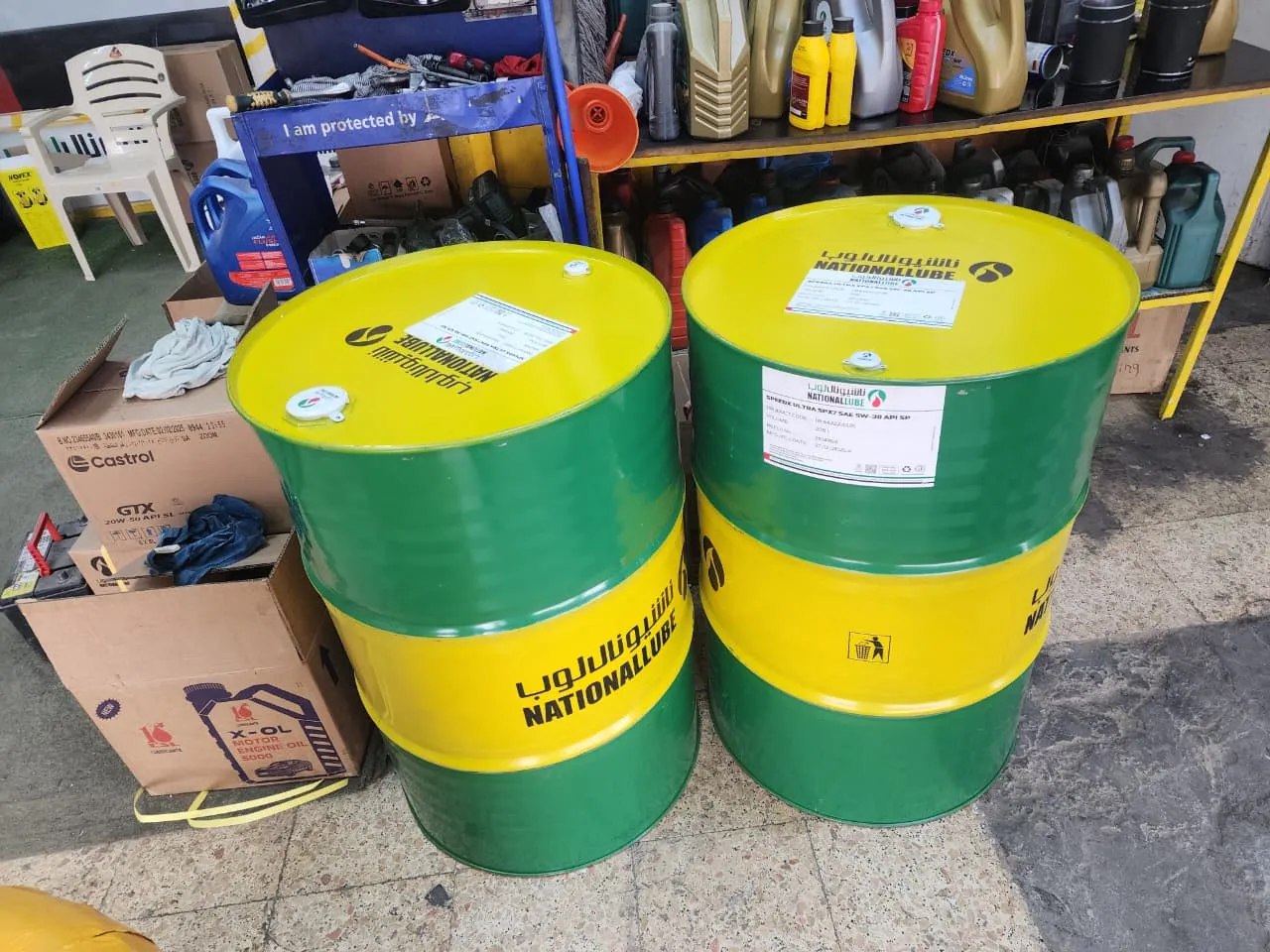 Lubricant drums loaded on pickup truck for industrial delivery in Dubai